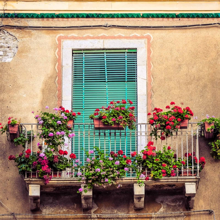 Vintage balcony with shutters