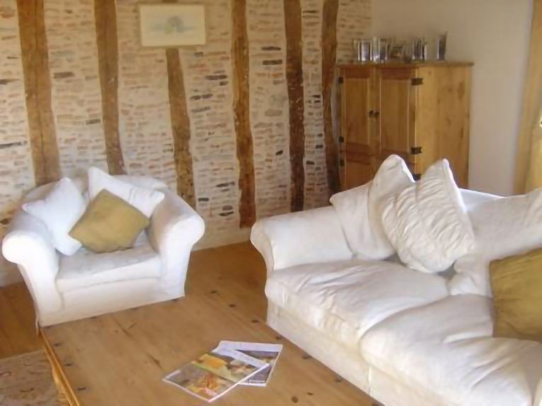 Sitting room with exposed beams