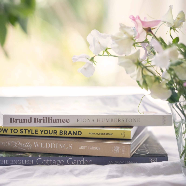 Web design reference books on table